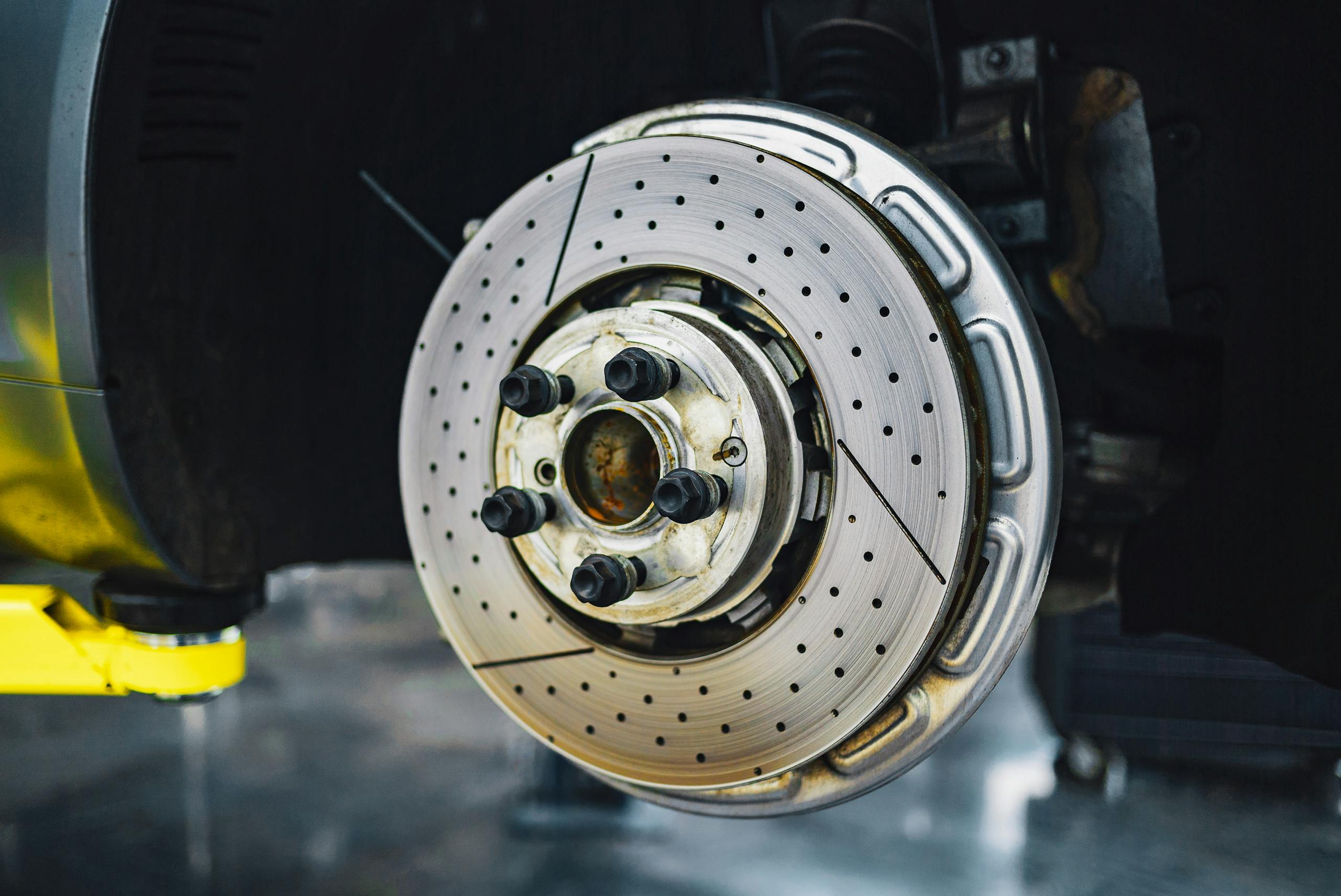 Detailed view of a car brake disk showcasing automotive parts and craftsmanship.